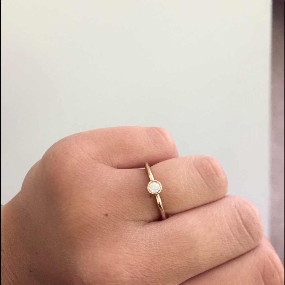 Gold ring with white sparkle